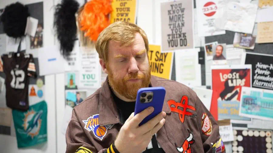 Craig Burgess in the Genius Division office
